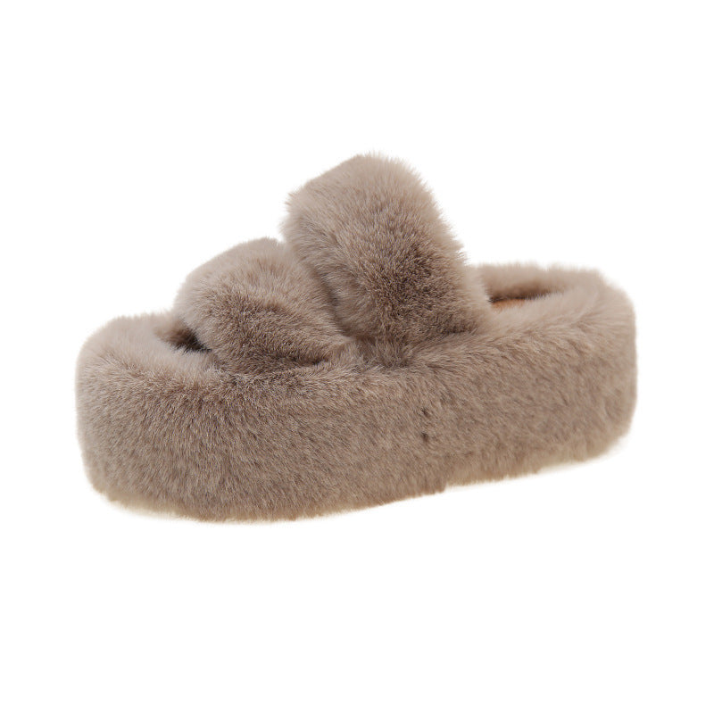 Thick-soled fuzzy slipper.