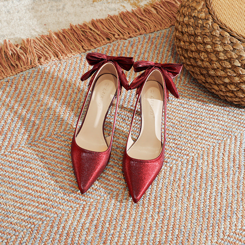 High-heeled pointed toe pumps with bow detail