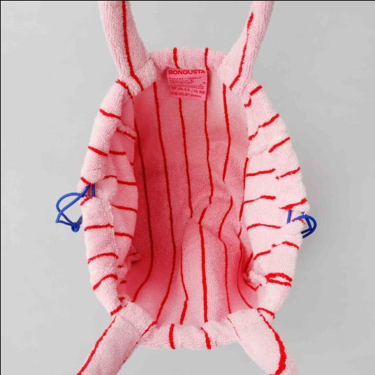 A multi-color striped terry cloth bag with drawstring