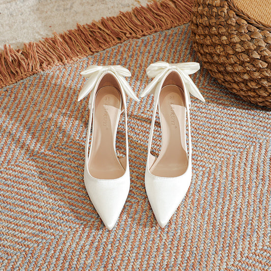 High-heeled pointed toe pumps with bow detail