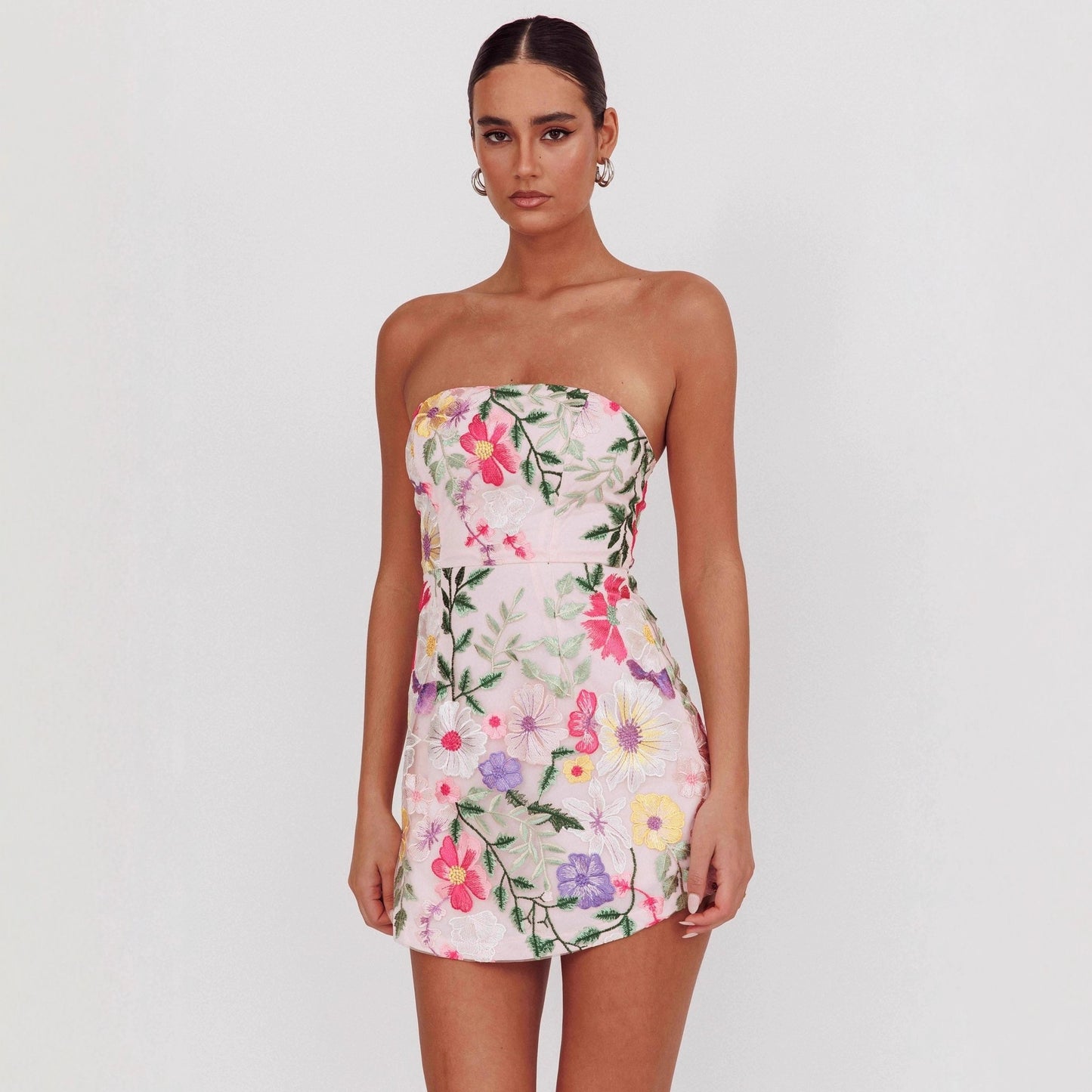 figure-hugging strapless short floral dress