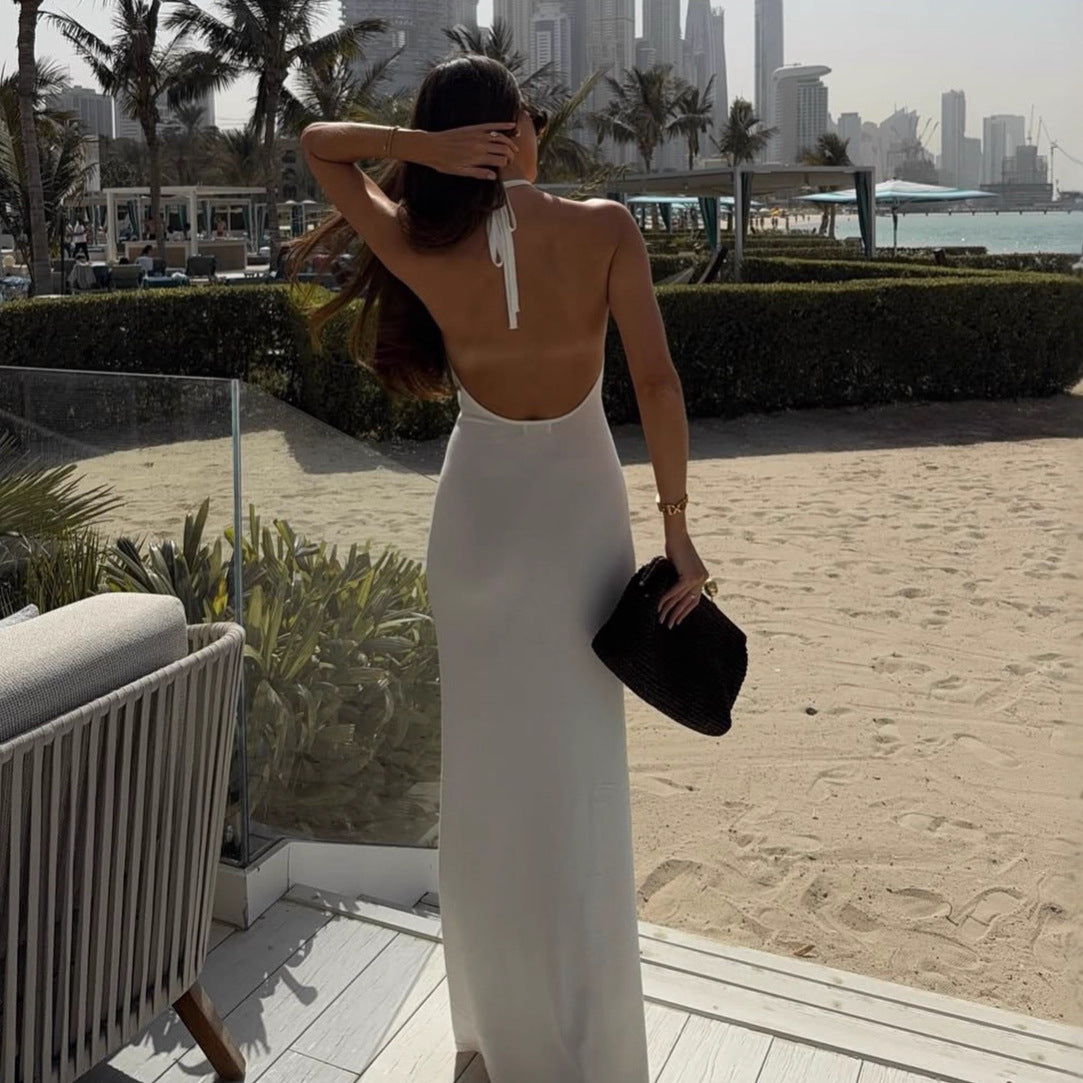 Women's figure-hugging, halter-neck dress with cut outs