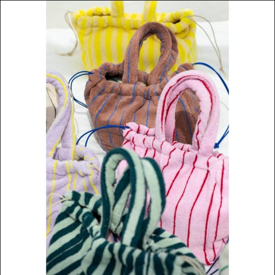 A multi-color striped terry cloth bag with drawstring