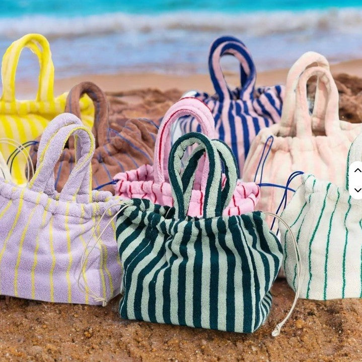 A multi-color striped terry cloth bag with drawstring