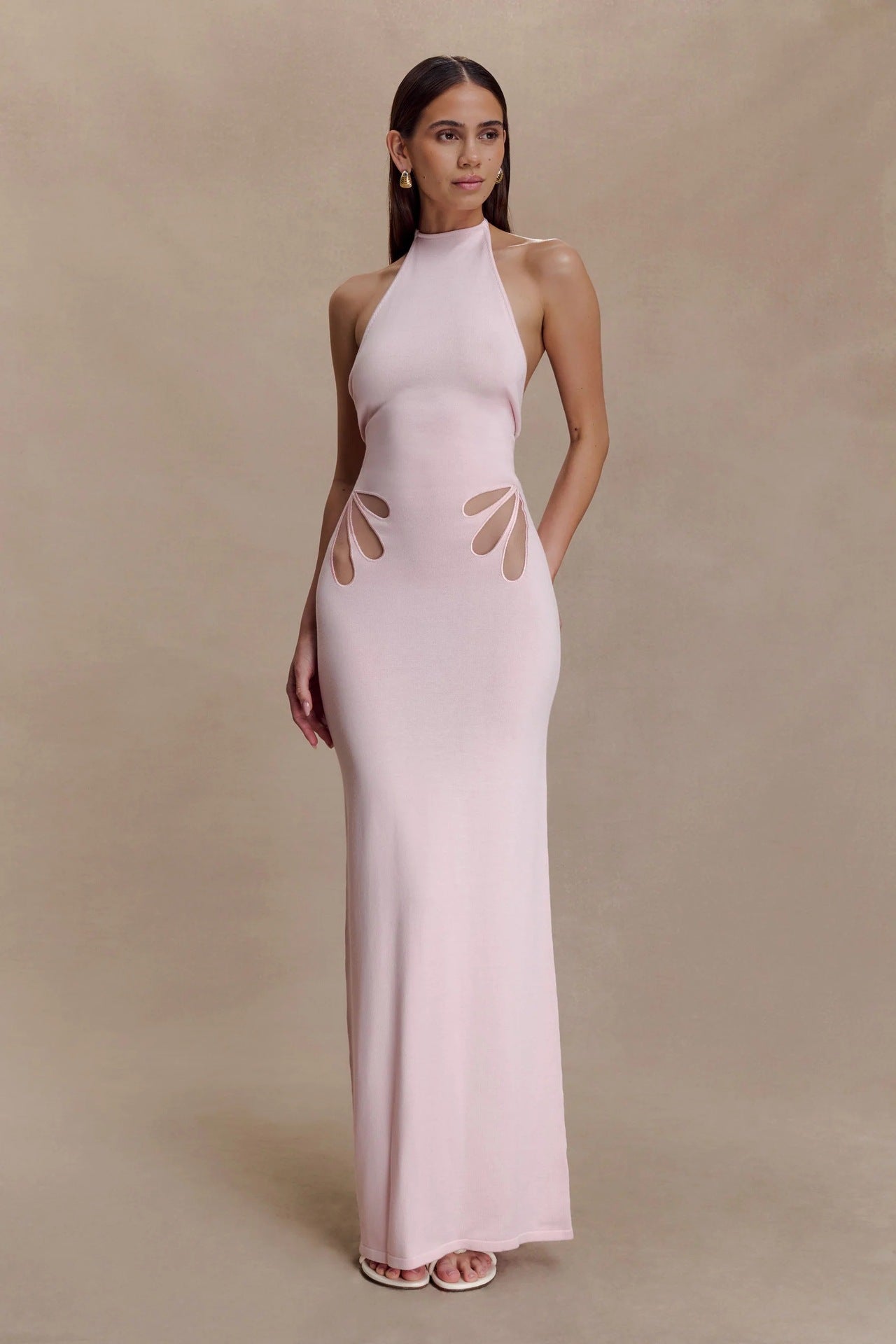 Women's figure-hugging, halter-neck dress with cut outs