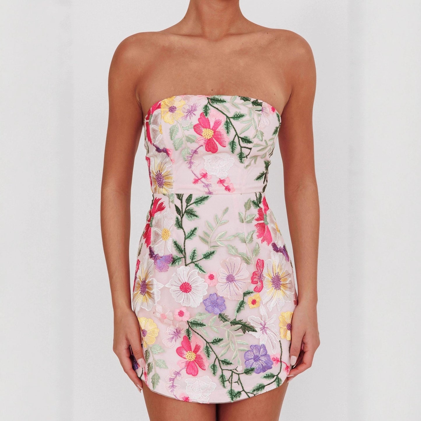 figure-hugging strapless short floral dress