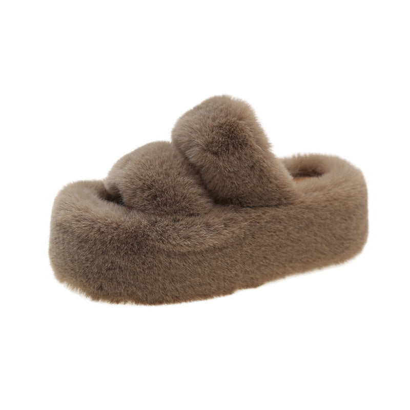 Thick-soled fuzzy slipper.