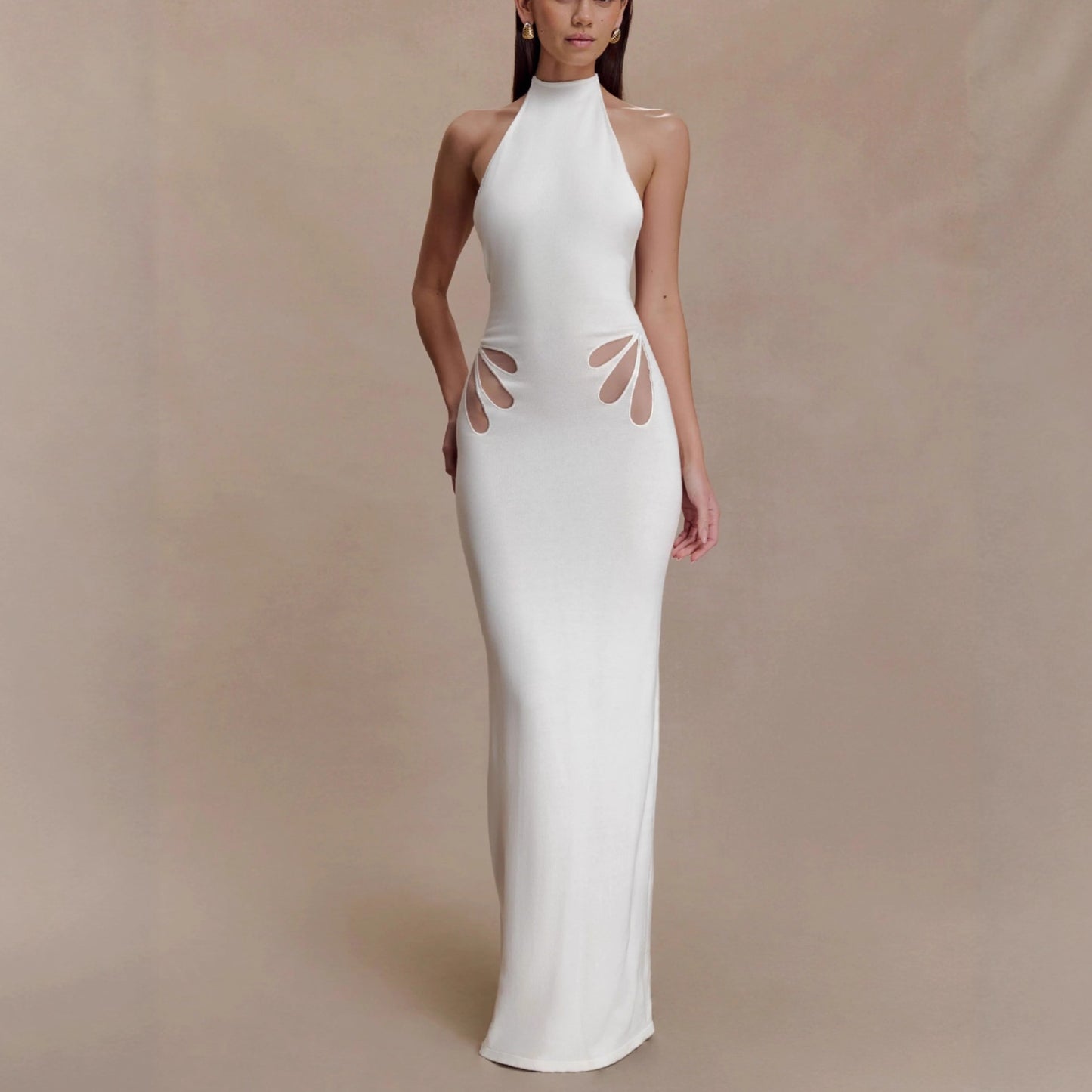 Women's figure-hugging, halter-neck dress with cut outs