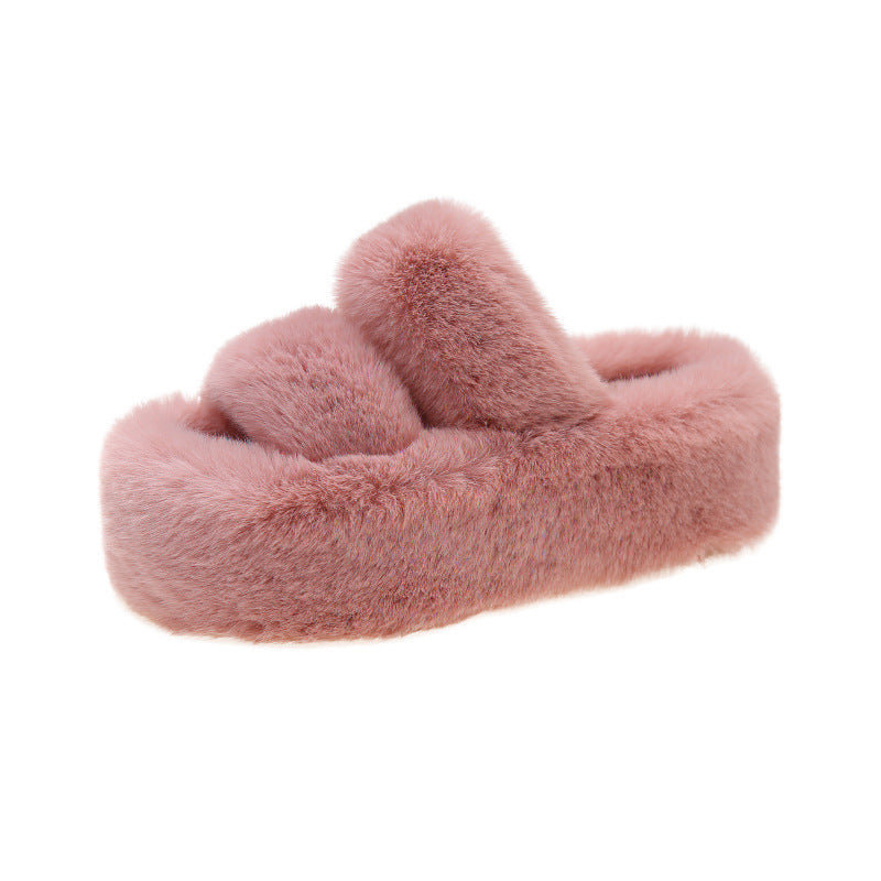 Thick-soled fuzzy slipper.