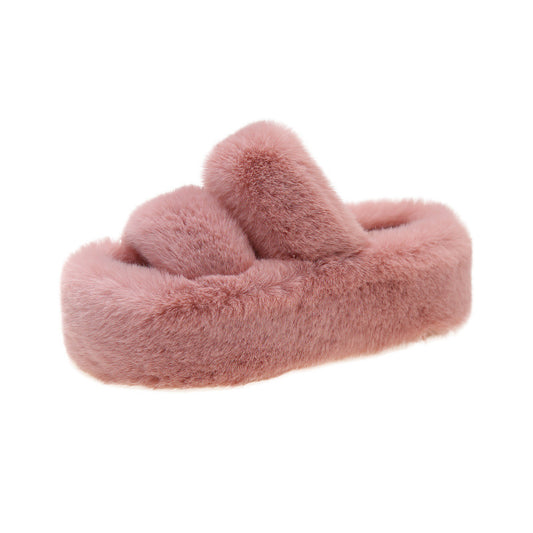 Thick-soled fuzzy slipper.