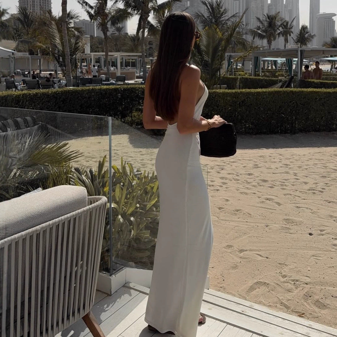 Women's figure-hugging, halter-neck dress with cut outs