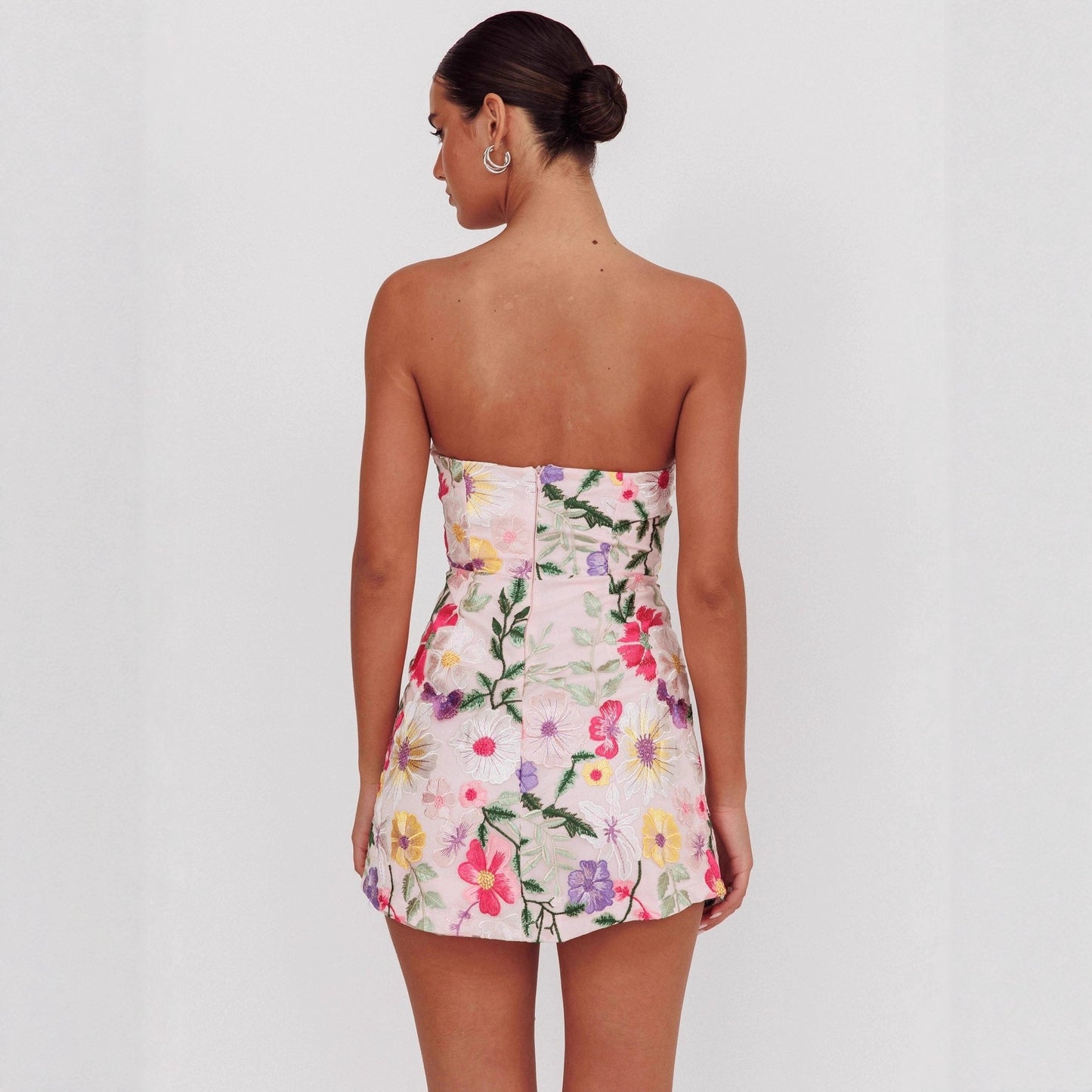 figure-hugging strapless short floral dress